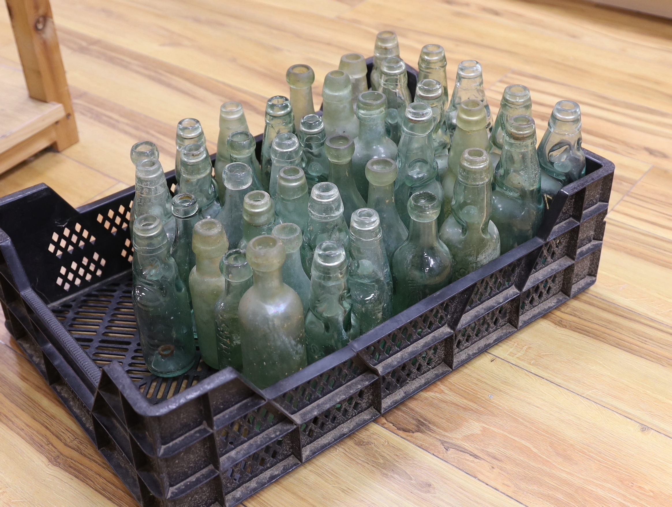 A quantity of early to mid 20th century glass bottles